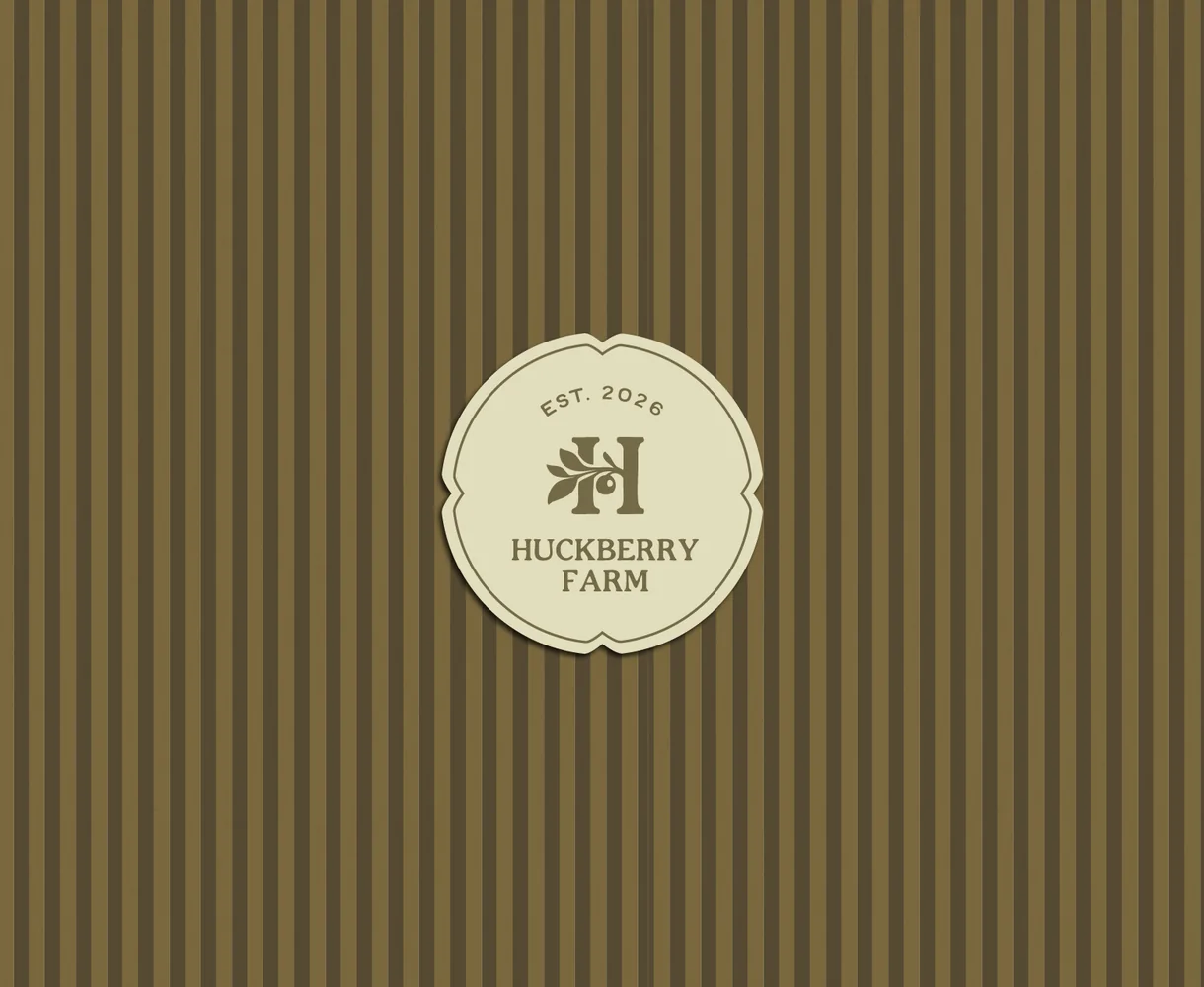 Huckberry Farm est. 2026 seal on the olive ticking stripe